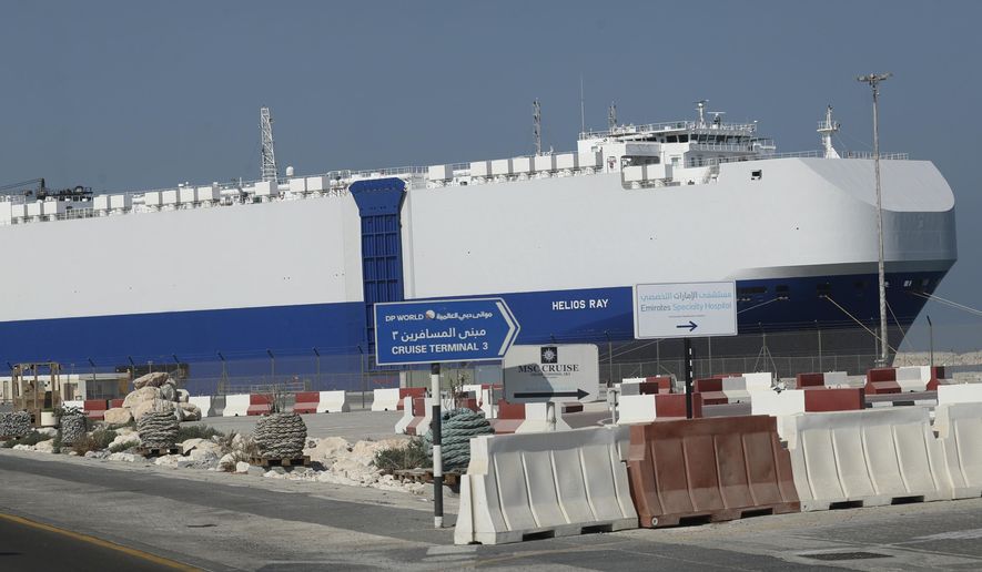 The Israeli-owned cargo ship, Helios Ray, sits docked in port after arriving earlier in Dubai, United Arab Emirates, Sunday, Feb. 28, 2021. The ship has been damaged by an unexplained blast at the gulf of Oman on Thursday. (AP Photo/Kamran Jebreili)