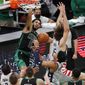 Boston Celtics&#39; Jayson Tatum (0) dunks against Washington Wizards&#39; Robin Lopez (15) during the first half of an NBA basketball game, Sunday, Feb. 28, 2021, in Boston. (AP Photo/Michael Dwyer)