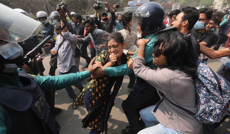 Bangladeshi students clash with police during a protest in Dhaka, Bangladesh, Monday, March 1, 2021. About 300 student activists rallied in Bangladesh’s capital on Monday to denounce the death in prison of Mushtaq Ahmed, a writer and commentator who was arrested last year on charges of violating a sweeping digital security law that critics say chokes freedom of expression. (AP Photo/Mahmud Hossain Opu)