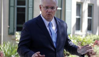 Australia&#39;s Prime Minister Scott Morrison speaks to the media in Sydney, Monday, March 1, 2021. Morrison stood by an unnamed Cabinet minister against calls for him to step down from office over an allegation that he raped a 16-year-old girl more than 30 years ago. (AP Photo/Rick Rycroft)