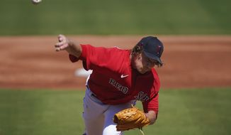 Boston Red Sox starting pitcher Garrett Richards throws in the first inning during a spring training baseball game against the Atlanta Braves on Monday, March 1, 2021, in Fort Myers, Fla. (AP Photo/Brynn Anderson)