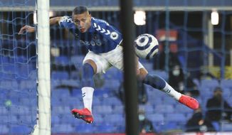 Everton&#x27;s Richarlison scores his side&#x27;s opening goal during the English Premier League soccer match between Everton and Southampton at Goodison Park in Liverpool, England, Monday, March 1, 2021. (Clive Brunskill/Pool via AP)