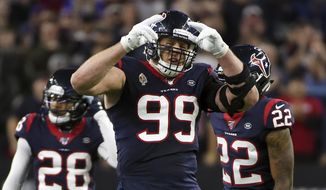 FILE - Houston Texans defensive end J.J. Watt (99) celebrates during the second half of an NFL wild-card playoff football game against the Buffalo Bills in Houston, in this Saturday, Jan. 4, 2020, file photo. J.J. Watt has agreed to a two-year contract with the Arizona Cardinals. The team announced the deal with the free-agent edge rusher on Monday, March 1, 2021. Watt was released last month by the Houston Texans. (AP Photo/Eric Christian Smith, File)