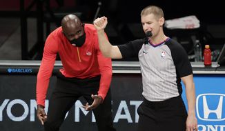 FILE - In this Friday, Jan. 1, 2021, file photo, Atlanta Hawks head coach Lloyd Pierce reacts to a call by referee Tyler Ford during an NBA basketball game against the Brooklyn Nets, in New York. On Monday, March 1, 2021, Pierce was fired less than halfway into a season that began with heightened expectations but was beset by injuries. (AP Photo/Adam Hunger, File)