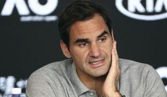 FILE - In this Jan. 30, 2020, file photo, Switzerland&#39;s Roger Federer speaks during a press conference following his semifinal loss to Serbia&#39;s Novak Djokovic at the Australian Open tennis championship in Melbourne, Australia. Federer is withdrawing from this month&#39;s Miami Open so he can spend extra time preparing to “work his way back out on tour,” his agent told The Associated Press on Monday, March 1, 2021. (AP Photo/Dita Alangkara, File)