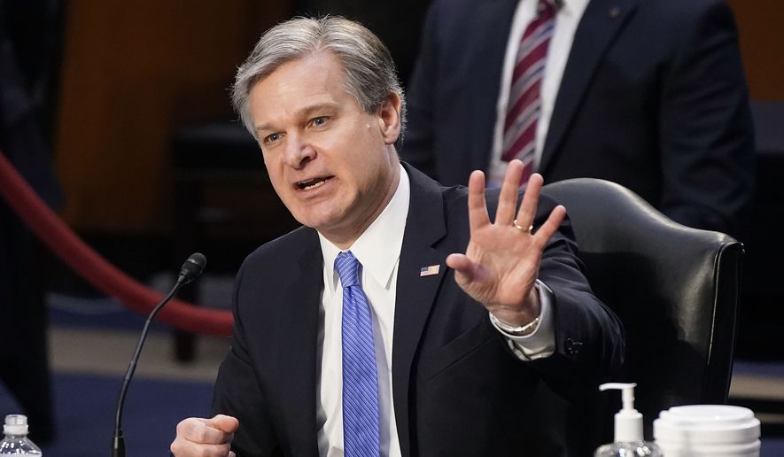 FBI Director Christopher Wray testifies before the Senate Judiciary Committee on Capitol Hill in Washington, Tuesday, March 2, 2021. Wray is condemning the Jan. 6 riot at the U.S. Capitol as “domestic terrorism.” (AP Photo/Patrick Semansky)