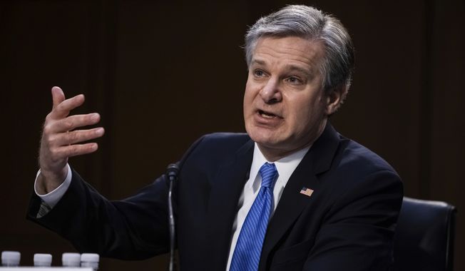 FBI Director Christopher Wray testifies before the Senate Judiciary Committee on Capitol Hill in Washington, Tuesday, March 2, 2021. (Graeme Jennings/Pool via AP) **FILE**