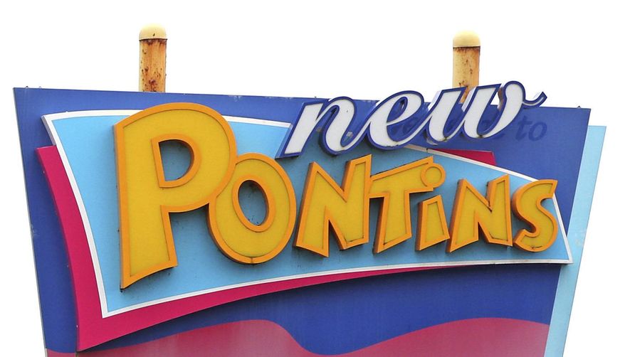 FILE - This Nov. 5, 2020 file photo shows a sign for a Pontins holiday park. A chain of holiday parks in Britain kept an “undesirable guests” list of Irish surnames in an attempt to keep out members of the Irish Traveller community, the U.K. equalities watchdog said Tuesday March 2, 2021. (Peter Byrne/PA via AP, File)