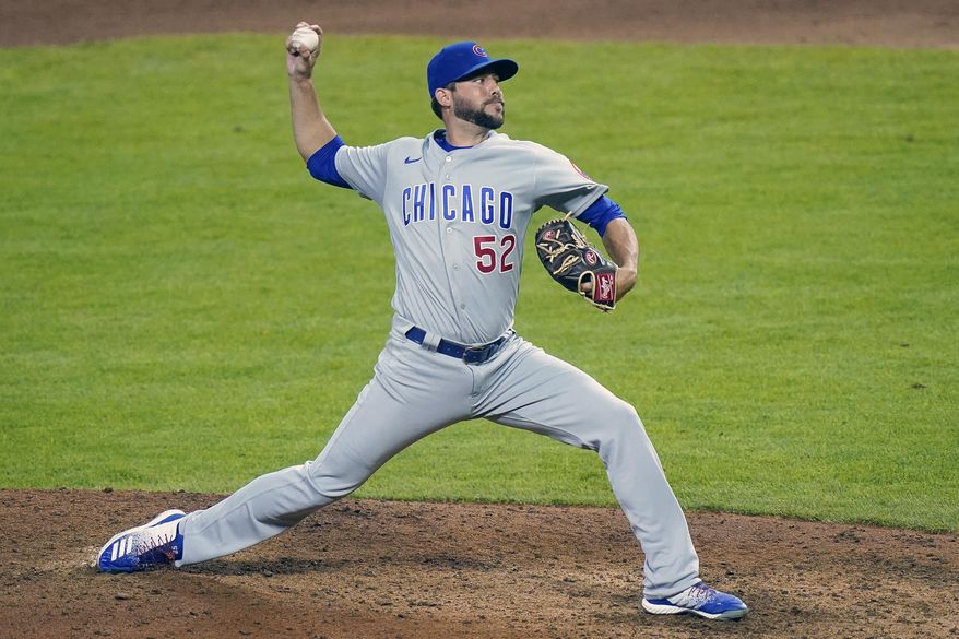 FILE - Chicago Cubs relief pitcher Ryan Tepera (52) pitches during a baseball game against the Cincinnati Reds at Great American Ball Park in Cincinnati, in this Monday, July 27, 2020, file photo. The Cubs finalized an $800,000, one-year deal with reliever Ryan Tepera on Tuesday, March 2, 2021, a deal that allows him to earn up to $1.75 million, and opened a roster spot by designating right-hander Duane Underwood Jr. for assignment. (AP Photo/Bryan Woolston, File)