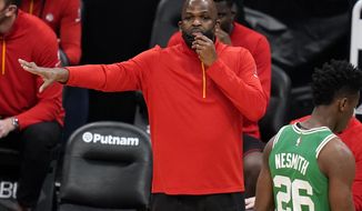 FILE - Atlanta Hawks associate head coach Nate McMillan calls to his players during the second half of an NBA basketball game against the Boston Celtics in Boston, in this Wednesday, Feb. 17, 2021, file photo. Newly named Atlanta Hawks interim coach Nate McMillan will have his debut in Tuesday night&#x27;s, March 2, 2021, game at Miami. His opportunity to return to a head coach position comes with mixed feelings following Monday&#x27;s firing of his friend, Lloyd Pierce. (AP Photo/Charles Krupa, File)