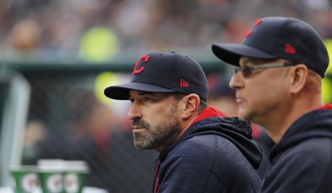 Cleveland Indians pitching coach Mickey Callaway, left, watches with manager Terry Francona during the first inning of a baseball game against the Detroit Tigers, in Detroit, in this May 3, 2017, file photo. Indians manager Terry Francona said no one in the Cleveland organization “covered up” for former pitching coach Mickey Callaway, who is under investigation by Major League Baseball following allegations of sexual harassment.In a story Tuesday, March 2, 2021, The Athletic reported that 12 current and former Indians employees have come forward in the last month to say the Indians were aware of Callaway’s inappropriate behavior while he was their pitching coach from 2013-17. (AP Photo/Paul Sancya, File) **FILE**