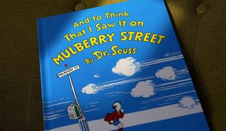 A copy of the book &amp;quot;And to Think That I Saw It on Mulberry Street,&amp;quot; by Dr. Seuss, rests in a chair, Monday, March 1, 2021, in Walpole, Mass. Dr. Seuss Enterprises, the business that preserves and protects the author and illustrator&#39;s legacy, announced on his birthday, Tuesday, March 2, 2021, that it would cease publication of several children&#39;s titles including &amp;quot;And to Think That I Saw It on Mulberry Street&amp;quot; and &amp;quot;If I Ran the Zoo,&amp;quot; because of insensitive and racist imagery. (AP Photo/Steven Senne)