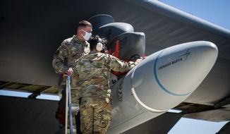 Air Force personnel are shown in this file photo preparing for an air-launched test of the booster for the new AGM-183A Air-Launched Rapid Response Weapon, or ARRW. (U.S. Air Force/File)  **FILE**