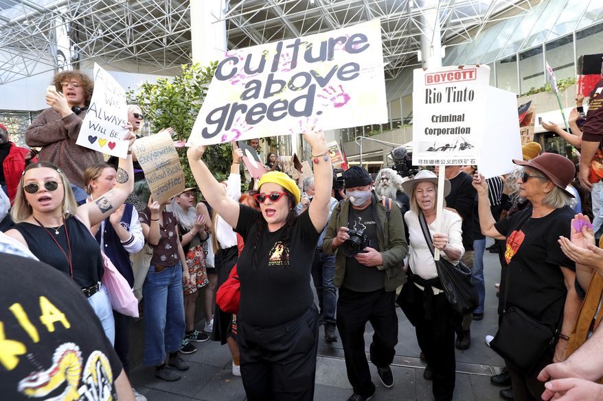 Protesters rally outside the Rio Tinto office in Perth, Australia, on June 9, 2020. Rio Tinto chairman Simon Thompson said Wednesday, March 3, 2021 he was accountable for the mining giant destroying sacred Indigenous sites in Australia to access iron ore and he will not seek reelection as a board director next year. (Richard Wainwright/AAP Image/ via AP)