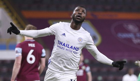 Leicester City&#39;s Kelechi Iheanacho celebrates scoring their side&#39;s first goal during the English Premier League soccer match between Burnley and Leicester City at Turf Moor stadium in Burnley, England, Wednesday, March 3, 2021.(Alex Pantling/Pool via AP)