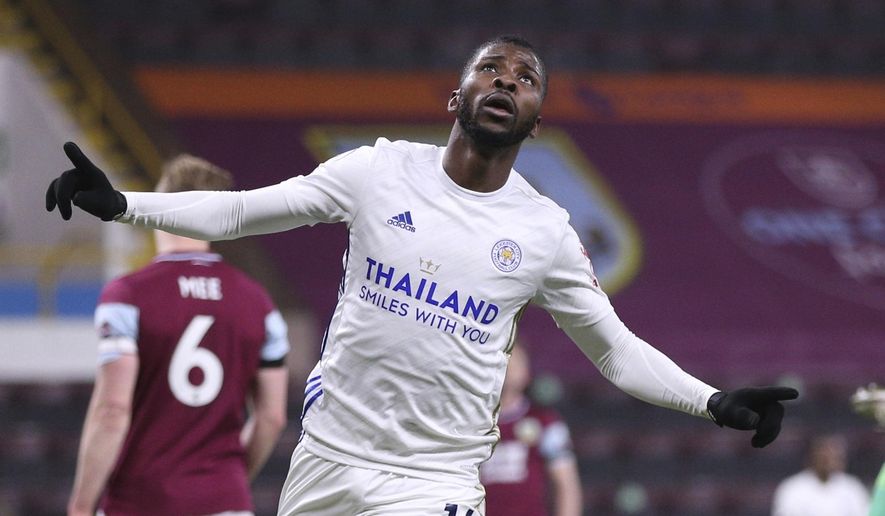 Leicester City&#x27;s Kelechi Iheanacho celebrates scoring their side&#x27;s first goal during the English Premier League soccer match between Burnley and Leicester City at Turf Moor stadium in Burnley, England, Wednesday, March 3, 2021.(Alex Pantling/Pool via AP)