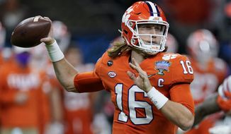 FILE - In this Friday, Jan. 1, 2021 file photo, Clemson quarterback Trevor Lawrence passes against Ohio State during the first half of the Sugar Bowl NCAA college football game in New Orleans. The last NFL event not impacted by the COVID-19 pandemic was the 2020 combine in Indianapolis. A year later, with the 2021 combine canceled, the league has released a list of players who would have merited invitations. From such high-profile quarterbacks as Clemson’s Trevor Lawrence and Ohio State’s Justin Fields to guys who sat out last season such as Oregon tackle Penei Sewell, there are 323 players from 100 schools.  (AP Photo/John Bazemore, File)