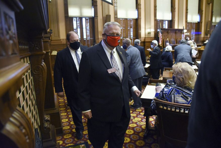 David Ralston, Speaker of the House, leaves after the session adjourned on the House Chambers during the second day of the 2021 legislative session at the Georgia State Capitol, Tuesday, Jan. 12, 2021, in Atlanta. (Hyosub Shin/Atlanta Journal-Constitution via AP)