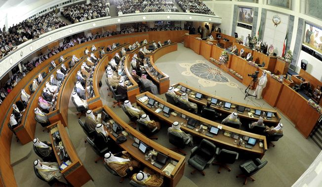FILE - This Dec. 16, 2012 file photo shows a General view of Kuwait&#x27;s National Assembly, in Kuwait. A new cabinet was sworn in Wednesday, March 3, 2021, state-run media reported, weeks after the government quit amid a deepening deadlock with parliament that has blocked badly needed reform in the tiny oil-rich Gulf state. Prime Minister Sheikh Sabah Al-Khaled Al Hamad Al Sabah swapped out four ministers whose selections had angered various lawmakers for less contentious, veteran politicians, an apparent gesture to appease parliament. (AP Photo/Gustavo Ferrari, File)
