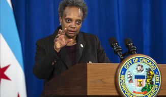 FILE - In this Dec. 17, 2020, file photo, Chicago Mayor Lori Lightfoot speaks during a news conference at City Hall in Chicago. Lightfoot on Wednesday, March, 3, 2021, proposed changes in the way police serve search warrants, the latest move to regain public trust in her as well as the police force that was damaged when officers stormed into the wrong home and forced the woman living there to stand naked in handcuffs for several minutes. (Anthony Vazquez/Chicago Sun-Times via AP, File)