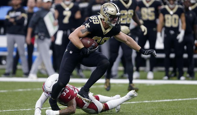 FILE - In this  Sunday, Oct. 27, 2019 file photo, New Orleans Saints tight end Josh Hill (89) carries against Arizona Cardinals cornerback Byron Murphy (33) in the first half of an NFL football game in New Orleans. The New Orleans Saints cut eight-year veteran tight end and special teams regular Josh Hill on Wednesday, March 3, 2021 and also voided the contract of Jared Cook, who was due to become a free agent this offseason. The decision to release the 6-foot-5, 250-pound Hill saves the Saints about $2.6 million in salary cap space for the coming season.(AP Photo/Butch Dill, File)