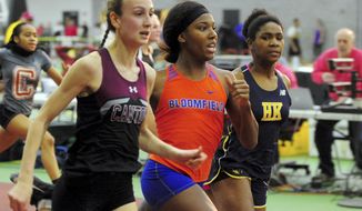 In this Friday, Feb. 14, 2020, file photo, Canton High School&#39;s Chelsea Mitchell, left, runs to beat Terry Miller, center, of Bloomfield, in the CIAC Class S track and field championships at Floyd Little Athletic Center in New Haven, Conn. center. Between 2017 and 2019, transgender sprinters Miller and Andraya Yearwood combined to win 15 championship races, prompting a lawsuit on behalf of four cisgender girls. (Christian Abraham/Hearst Connecticut Media via AP) ** FILE **
