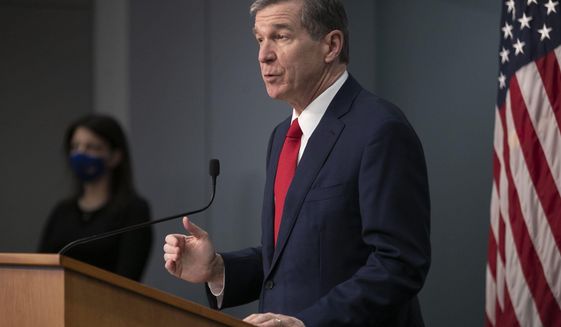 North Carolina Governor Roy Cooper speaks during a press briefing on the COVID-19 virus and vaccination efforts on Tuesday, March 2, 2021, at the Emergency Operations Center in Raleigh, N.C. (Robert Willett/The News &amp;amp; Observer via AP)