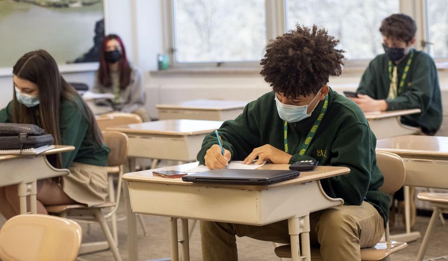 Freshman Nicholas Brown takes a pre-geometry pop quiz with his classmates at Seton LaSalle Catholic High School, Wednesday, March 3, 2021, in the Mt. Lebanon suburb of Pittsburgh. (Emily Matthews/Pittsburgh Post-Gazette via AP)