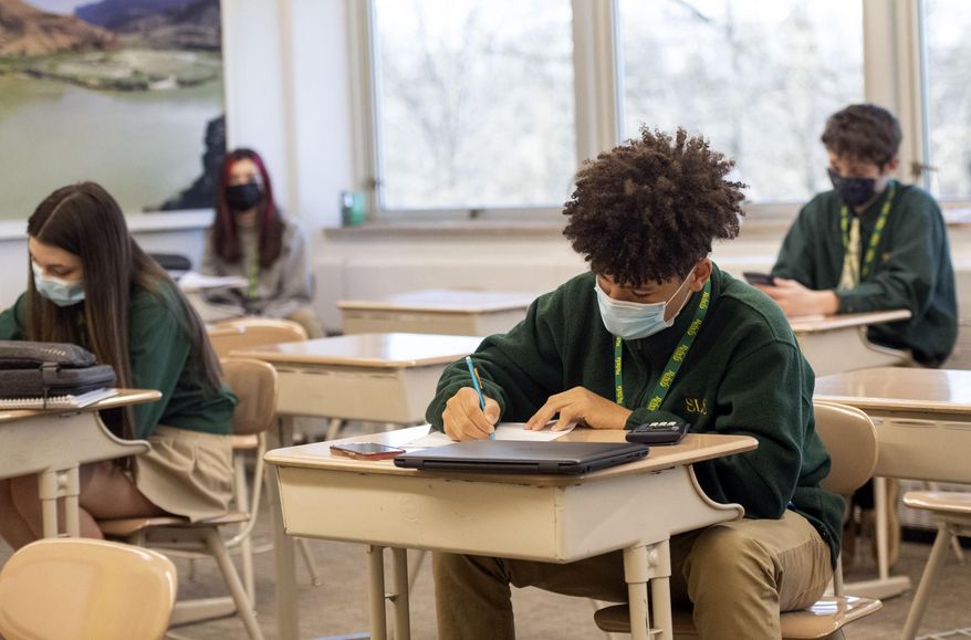 Freshman Nicholas Brown takes a pre-geometry pop quiz with his classmates at Seton LaSalle Catholic High School, Wednesday, March 3, 2021, in the Mt. Lebanon suburb of Pittsburgh. (Emily Matthews/Pittsburgh Post-Gazette via AP)