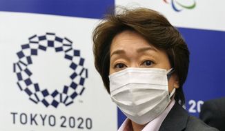 Seiko Hashimoto, president of the Tokyo 2020 Organizing Committee of the Olympic and Paralympic Games (Tokyo 2020), attends a news conference with Toshiro Muto, left, CEO of Tokyo 2020, after a council meeting in Tokyo on Wednesday, March 3, 2021. (Kimimasa Mayama/Pool Photo via AP)