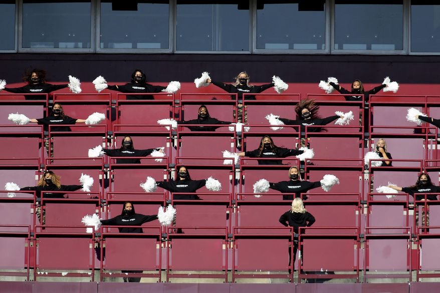 FILE - Washington Football Team cheerleaders perform before an NFL football game against the New York Giants in Landover, Md., in this Sunday, Nov. 8, 2020, file photo. The Washington Football Team will not have cheerleaders for the 2021 season as part of an organizational rebranding. Washington hired Petra Pope, who managed the "Laker Girls" and brings three decades of NBA experience as an adviser to take on the task of reinventing the group.(AP Photo/Daniel Kucin Jr., File)