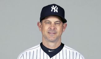 FILE - This is a Feb. 24, 2021, photo showing Aaron Boone of the New York Yankees baseball team. The New York Yankees announced Wednesday, March 3, 2021, that manager Aaron Boone is taking an immediate medical leave of absence to receive a pacemaker. (Mike Carlson/MLB Photos via AP, Pool) **FILE**
