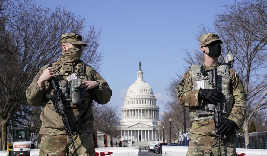 In this file photo, National Guard keep watch on the Capitol, Thursday, March 4, 2021, on Capitol Hill in Washington.  (AP Photo/Jacquelyn Martin)  **FILE**