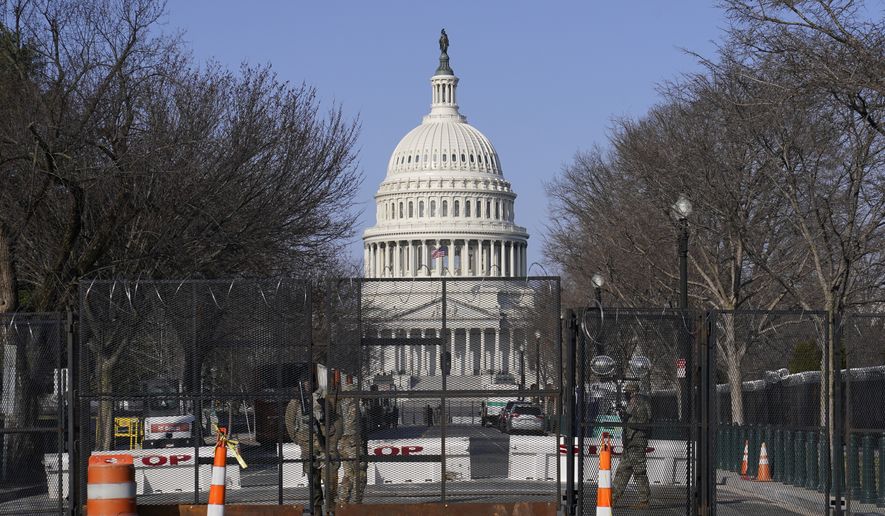 Security fencing surrounds Capitol Hill in Washington, Thursday, March 4, 2021. Capitol Police say they have uncovered intelligence of a &quot;possible plot&quot; by a militia group to breach the U.S. Capitol on Thursday, nearly two months after a mob of supporters of then-President Donald Trump stormed the iconic building to try to stop Congress from certifying now-President Joe Biden&#x27;s victory. (AP Photo/Susan Walsh) **FILE**