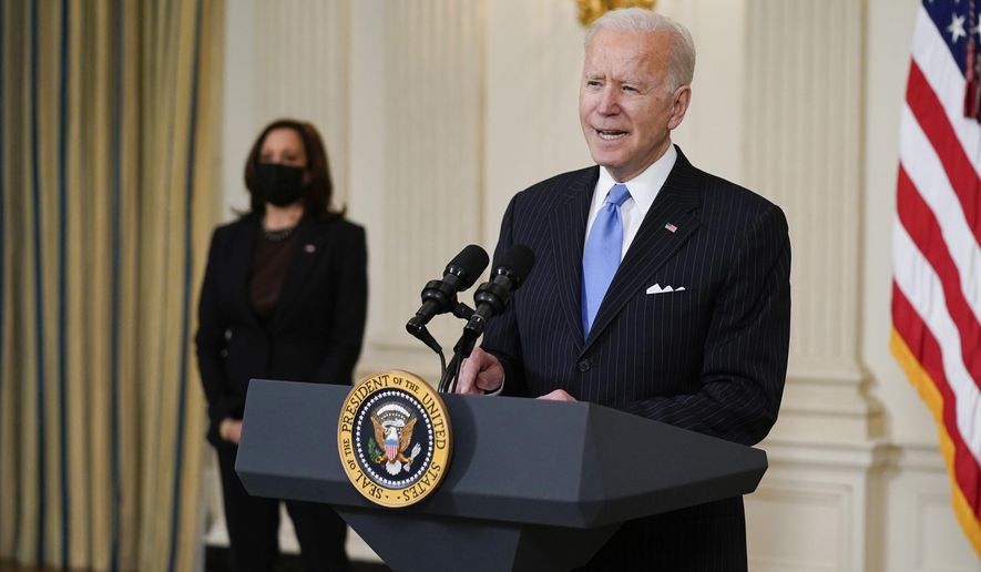 President Joe Biden, accompanied by Vice President Kamala Harris, speaks about efforts to combat COVID-19, in the State Dining Room of the White House, Tuesday, March 2, 2021, in Washington. (AP Photo/Evan Vucci)