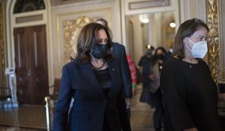 Vice President Kamala Harris arrives to break the tie on a procedural vote as the Senate works on the Democrats&#x27; $1.9 trillion COVID relief package, on Capitol Hill in Washington, Thursday, March 4, 2021. (AP Photo/J. Scott Applewhite)