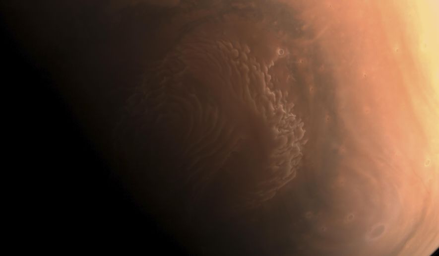 This image made available by the China National Space Administration on Thursday, March 4, 2021, shows a high-resolution photo of the surface of Mars taken by China's Tianwen-1 probe as it orbits the planet in preparation for landing. China says a cohort of astronauts have been selected and are in training to carry out four crewed missions this year as the country works to complete its first permanent orbiting space station. (CNSA via AP)