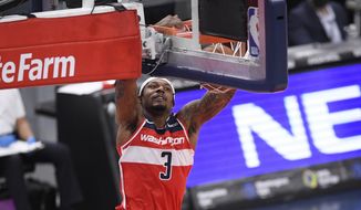 Washington Wizards guard Bradley Beal (3) goes to the basket during the first half of an NBA basketball game against the Los Angeles Clippers, Thursday, March 4, 2021, in Washington. (AP Photo/Nick Wass)