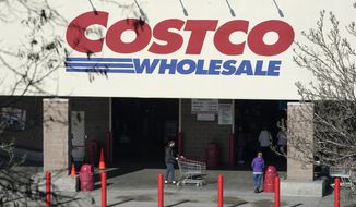 Shoppers walk into a Costco store, Wednesday, March 3, 2021, in Tacoma, Wash. (AP Photo/Ted S. Warren) **FILE**