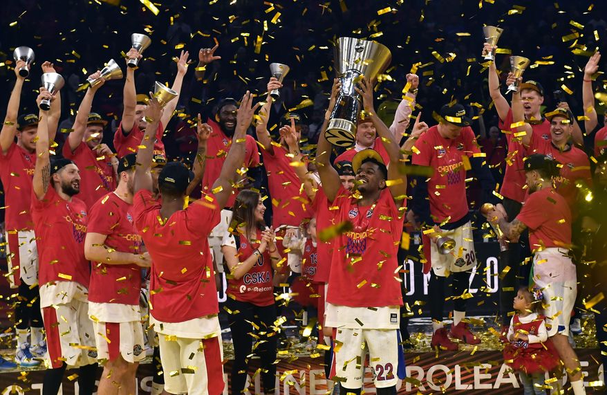 FILE - In this Sunday, May 19, 2019. file photo, Moscow players celebrate as they win the Final Four Euroleague final basketball match between Anadolu Efes Istanbul and CSKA Moscow at the Fernando Buesa Arena in Vitoria, Spain. The EuroLeague is hoping to have fans back at its Final Four this May in Cologne, Germany. The signature event of European basketball was called off last year because of the pandemic. (AP Photo/Alvaro Barrientos, File)
