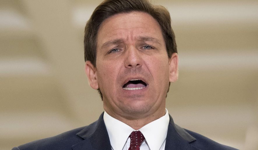 Florida Gov. Ron DeSantis speaks to the press after giving his State of the State speech on the first day of the 2021 Legislative Session in Tallahassee, Fla. Tuesday, March 2, 2021. (Tori Lynn Schneider/Tallahassee Democrat via AP)