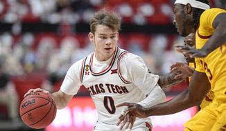 Texas Tech&#39;s Mac McClung (0) is defended by Iowa State&#39;s Tre Jackson (3) during the first half of an NCAA college basketball game in Lubbock, Texas, Thursday, March 4, 2021. (AP Photo/Justin Rex)
