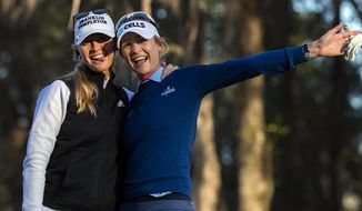 Sisters Jessica Korda, left, and Nelly Korda ham it up before the start of the first round for the LPGA golf tournament at Golden in Ocala Golf and Equestrian Club, Thursday, March 4, 2021, in Ocala, Fla. (Cyndi Chambers/in Ocala Star-Banner via AP)