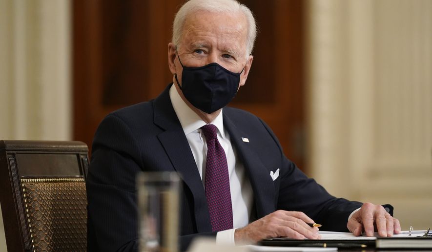 President Joe Biden participates in a roundtable discussion on a coronavirus relief package in the State Dining Room of the White House in Washington, Friday, March 5, 2021. (AP Photo/Patrick Semansky)