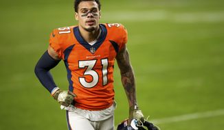 FILE  In this Nov. 22, 2020, file photo, Denver Broncos safety Justin Simmons (31) runs off the field after defeating the Miami Dolphins in an an NFL football game in Denver. Simmons is the first player franchise tagged in 2021. NFL teams have until Tuesday, March 9, 2021, at 4 p.m. ET to use their franchise tag to prevent a pending free agent from hitting the open market. (AP Photo/Justin Edmonds, File)