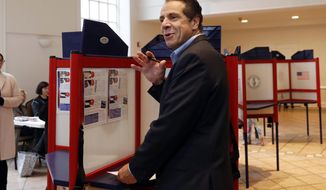 FILE — In this Nov. 6, 2018 file photo, New York Gov. Andrew Cuomo pauses as he marks his ballot, at the Presbyterian Church of Mount Kisco, in Mt. Kisco, N.Y.  New York’s attorney general has promised a thorough investigation of allegations that  Cuomo sexually harassed at least two women. (AP Photo/Richard Drew, File)