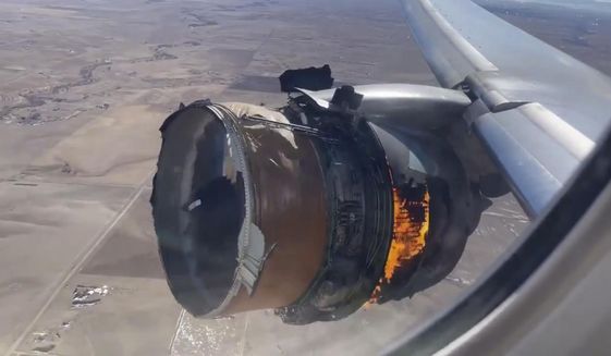 FILE - In this image taken from video, the engine of United Airlines Flight 328 is on fire after after experiencing &amp;quot;a right-engine failure&amp;quot; shortly after takeoff from Denver International Airport, Saturday, Feb. 20, 2021, in Denver, Colo.  Federal safety officials are updating their investigation into the engine failure on the United Airlines plane that sent parts of the engine housing raining down on Denver-area neighborhoods last month. The National Transportation Safety Board said Friday, March 5,  that a microscopic exam confirmed that a fan blade that snapped off had telltale signs of fatigue — tiny cracks caused by wear and tear.  (Chad Schnell via AP)