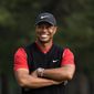 In this Oct. 28, 2019, file photo, Tiger Woods smiles during the winner&#x27;s ceremony after winning the Zozo Championship PGA Tour at the Accordia Golf Narashino country club in Inzai, east of Tokyo, Japan. A man who found Woods unconscious in a mangled SUV last week after the golf star who later told sheriff&#x27;s deputies he did not know how the collision occurred and didn&#x27;t even remember driving, crashed the vehicle in Southern California, authorities said in court documents. Law enforcement has not previously disclosed that Woods had been unconscious following the collision.  (AP Photo/Lee Jin-man, File) **FILE**