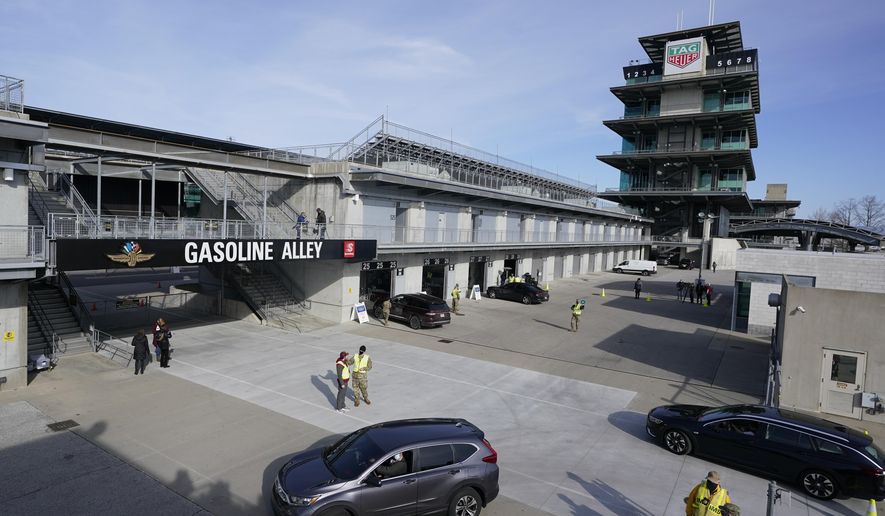 Patients arrive to receive the the single-dose Johnson & Johnson COVID-19 vaccine during the state's first mass vaccination clinic at the Indianapolis Motor Speedway, Friday, March 5, 2021, in Indianapolis. The state health department said nearly 17,000 people had filled up four days of appointments for the speedway clinic being held Friday through Monday. (AP Photo/Darron Cummings)