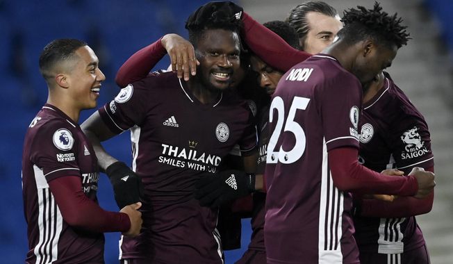 Leicester&#x27;s Daniel Amartey, 2nd right, is congratulated by his teammates after scoring his side&#x27;s second goal during the English Premier League soccer match between Brighton &amp;amp; Hove Albion and Leicester City at the AMEX Stadium in Brighton, England, Saturday, March 6, 2021. (Neil Hall/Pool via AP)